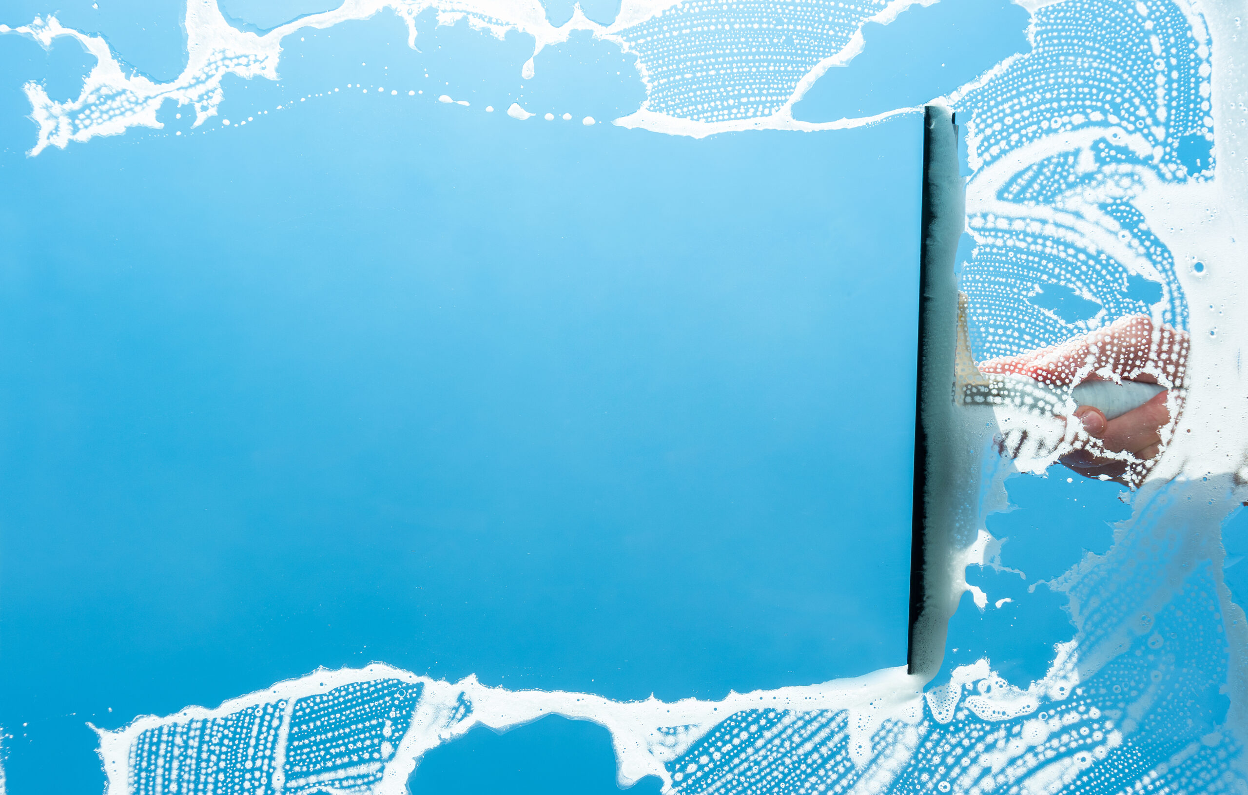 Perfect glass cleaning, housework with squeegee